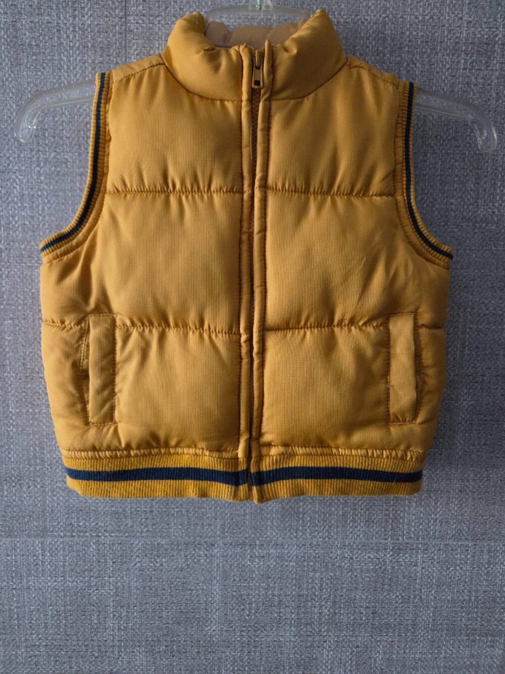 "Crazy8" kids mustard puffer vest size 2t/3t, 100% polyester.